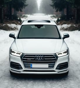 Audi Repair St. Louis 1 white Audi A8 on the road surrounded of trees / Audi Repair